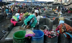 MOST PEOPLE HAND-WASHING CLOTHES SIMULTANEOUSLY (SINGLE LOCATION)