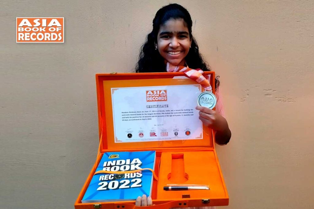 Longest duration to lock the neck with twisted hands by a child - Asia