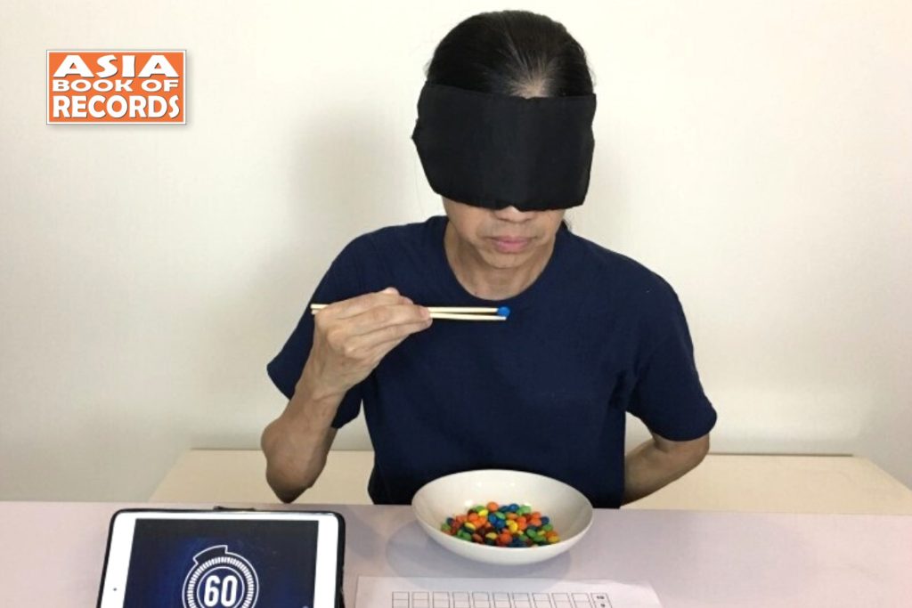 Eating Particles Maximum number of M&Ms eaten in one minute blindfolded with chopsticks ...