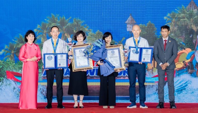 Nguyen Hoang Anh, Vice President of the Vietnam Book of Records & General Secretary of the World Records Union (extreme left) and Dr. Biswaroop Roy Chowdhury (extreme right) conferring the World Records Certificates to the officials of the Sun Group of Vietnam