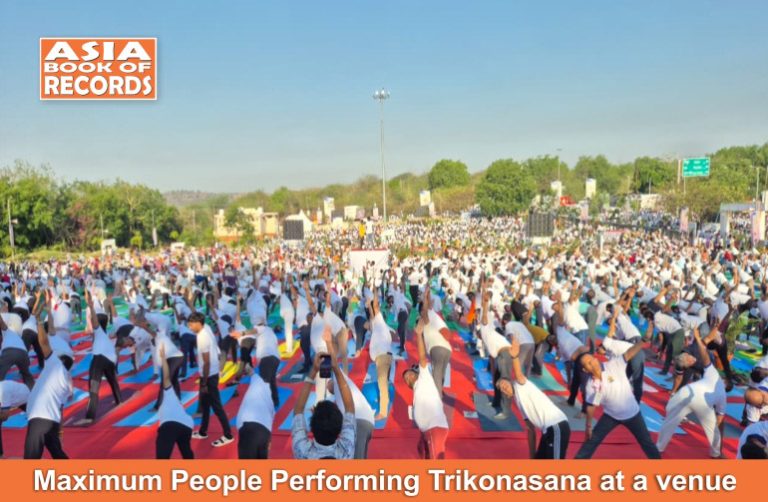 Maximum People Performing Trikonasana at a venue