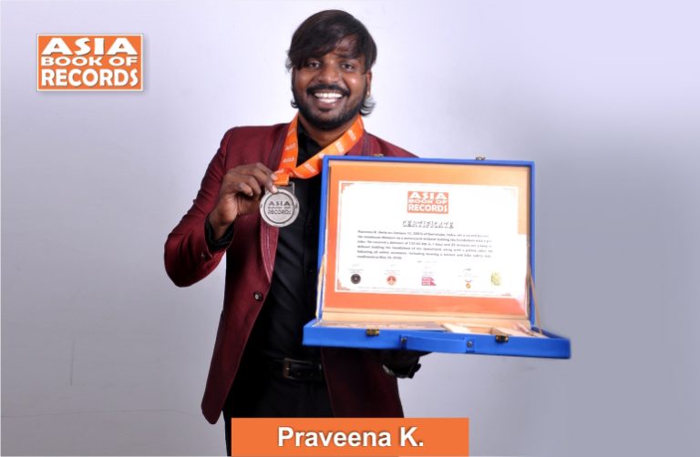Praveena K. - Maximum distance covered on a motorcycle without holding the handlebars with a pillion rider