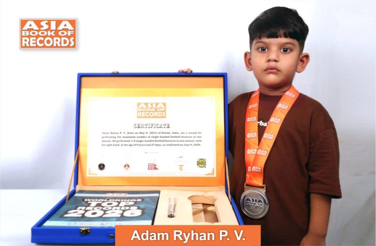 Maximum single-handed football bounces performed by a kid in one minute Image of Adam Ryhan P. V, Maximum single-handed football bounces performed by a kid in one minute.