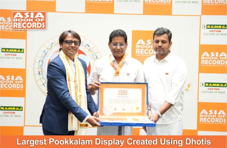 Largest Pookkalam Display Created Using Dhotis.