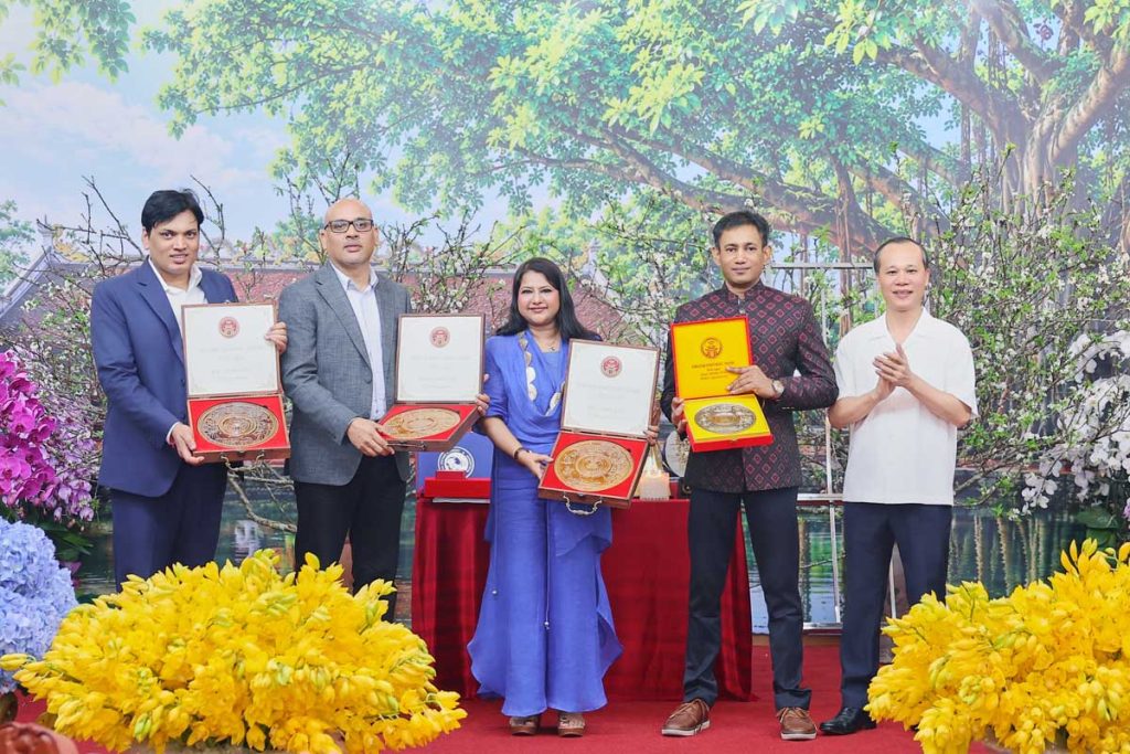 Indian delegates, including WAVES OTT Knowledge Partners Mr. Vikas Dubey and Mr. Jitendra Singh, Managing Editor of the India Book of Records Mrs. Neerja Roy Chowdhury, and President of the World Records Union Dr. Biswaroop Roy Chowdhury, are honoured in Hanoi, Vietnam, by Prof. Dr. Chu Bao Que, Chairman of the Policy and Development Consultative Council, Vietnam Federation of UNESCO Associations, following the successful release of the IBR-produced international film Vườn Tình Yêu – Prem Ki Surdhara on WAVES OTT.