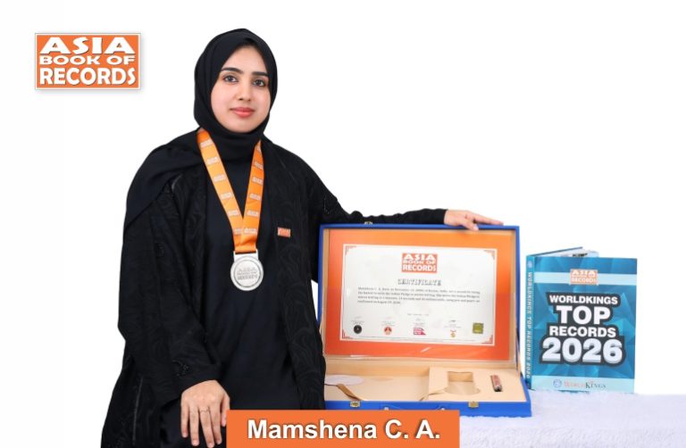 Fastest individual to write the Indian Pledge in mirror writing Image of Mamshena C.A, Fastest individual to write the Indian Pledge in mirror writing.